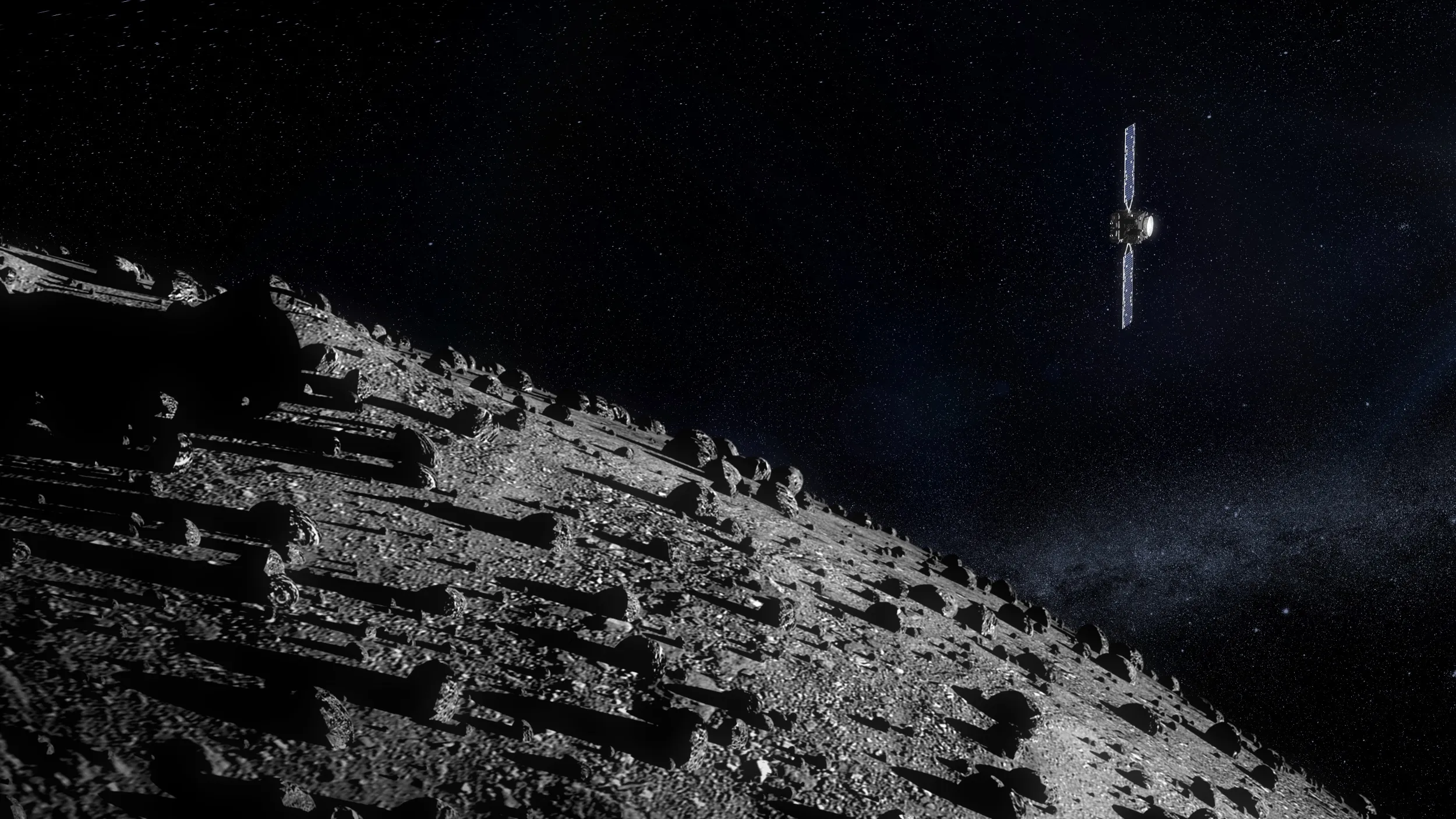 ESA's rendering of Hera above Dimorphos: a small box-shaped spacecraft with two long blue solar wings hangs top right against a field of stars, while below it a grey slope strewn with boulders casts long shadows towards the asteroid's horizon