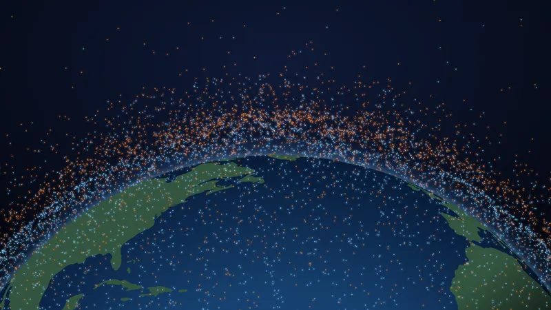 Ilustración: los objetos del catálogo estadounidense a este lado de la Tierra, dibujados donde estaban a las 16:17 UTC del 23 de septiembre de 2026, alrededor de la Tierra vista sobre el Atlántico, con América del Norte a la izquierda y África a la derecha. Los puntos azules, los satélites, en servicio o no, se agolpan en una capa baja junto a la Tierra; los naranjas, los fragmentos, las etapas de cohete agotadas y los objetos sin identificar, forman otra capa por encima. Las alturas están a escala; los puntos, ampliados
