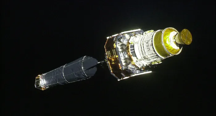 The Chandra X-ray Observatory against the black of space just after its release from Space Shuttle Columbia in 1999.