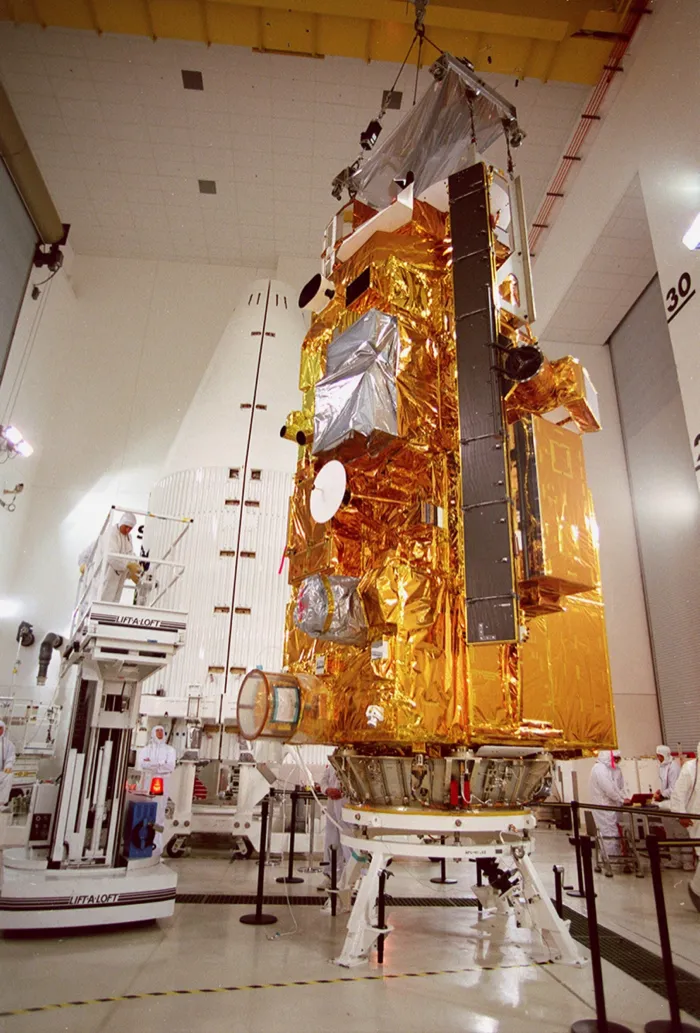 The Terra spacecraft, wrapped in gold thermal blankets, standing in the processing facility at Vandenberg before its launch in 1999.